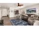 Bright living room offering tile floors, comfortable seating, and bar seating area at 3810 S Star Canyon Dr, Gilbert, AZ 85297