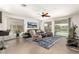 Cozy living room featuring comfortable seating, ample natural light, and access to the backyard at 3810 S Star Canyon Dr, Gilbert, AZ 85297