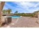 Backyard featuring a swimming pool, desert landscaping, a privacy fence, and patio seating at 3810 S Star Canyon Dr, Gilbert, AZ 85297