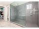 Modern bathroom featuring a glass shower enclosure and tiled walls at 3850 E Robert St, Gilbert, AZ 85295