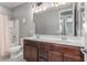 Bathroom featuring double sink vanity, a large mirror, and a shower-tub combo at 3850 E Robert St, Gilbert, AZ 85295