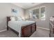 Bedroom featuring a bed with a blue quilt and artwork above at 3850 E Robert St, Gilbert, AZ 85295