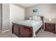 Bedroom featuring a bed with a blue quilt, closet and night stand at 3850 E Robert St, Gilbert, AZ 85295