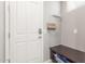 Inviting entryway featuring a convenient bench with storage and a stylish key rack at 3850 E Robert St, Gilbert, AZ 85295