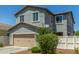Home with a two car garage and low maintenance landscaping at 3850 E Robert St, Gilbert, AZ 85295