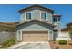 Two-story home with a two car garage and light brown trim at 3850 E Robert St, Gilbert, AZ 85295