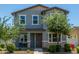 Inviting two-story home featuring a cozy front porch and manicured landscaping at 3850 E Robert St, Gilbert, AZ 85295