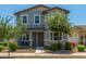 Inviting two-story home featuring a cozy front porch and manicured landscaping at 3850 E Robert St, Gilbert, AZ 85295