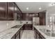 Well-equipped kitchen with stainless steel appliances, granite countertops, and ample cabinet space at 3850 E Robert St, Gilbert, AZ 85295