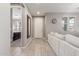 Open living area featuring tiled floors, a mirror, and light gray couch at 3850 E Robert St, Gilbert, AZ 85295
