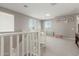 Bright loft space with neutral walls and carpet, multiple windows, and versatile living area at 3850 E Robert St, Gilbert, AZ 85295