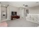 Upstairs loft with a TV, carpeted flooring, and access to multiple rooms, perfect for relaxation at 3850 E Robert St, Gilbert, AZ 85295