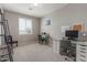 Bright office with a modern glass desk, office chair, and two accent chairs at 3850 E Robert St, Gilbert, AZ 85295