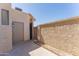 Private backyard featuring stucco walls and a storage shed at 3930 W Monterey St # 136, Chandler, AZ 85226
