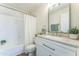 Well-lit bathroom featuring a white vanity, granite countertop, framed mirror, and shower-tub combination at 3930 W Monterey St # 136, Chandler, AZ 85226