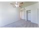 Bedroom featuring vaulted ceiling, ceiling fan and closet with sliding doors at 3930 W Monterey St # 136, Chandler, AZ 85226