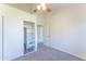 Bedroom featuring vaulted ceiling, ceiling fan, open shelving in closet at 3930 W Monterey St # 136, Chandler, AZ 85226