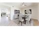 Bright dining room features modern decor, a glass table set, and views into the adjacent spaces at 3930 W Monterey St # 136, Chandler, AZ 85226