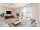 Comfortable living room with a large sliding glass door, a modern fireplace, and stylish decor at 3930 W Monterey St # 136, Chandler, AZ 85226