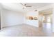 Open concept living room with a pass through to the updated kitchen at 3930 W Monterey St # 136, Chandler, AZ 85226