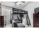 Bedroom featuring a loft bed with desk underneath and wood-look flooring at 3935 E Graphite Rd, San Tan Valley, AZ 85143