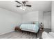 Cozy bedroom with wood-look floors, a ceiling fan, and a comfortable bed at 3935 E Graphite Rd, San Tan Valley, AZ 85143
