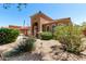 Beautiful single-story home with a tile roof, an arched entryway, a well-maintained desert front yard, and a two-car garage at 3935 E Graphite Rd, San Tan Valley, AZ 85143