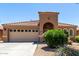 Charming single-story home with tile roof, arched entryway, desert landscaping, and a spacious two-car garage at 3935 E Graphite Rd, San Tan Valley, AZ 85143