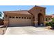 Attractive single-story home with a tile roof, arched entryway, neat desert landscaping, and a two-car garage and long driveway at 3935 E Graphite Rd, San Tan Valley, AZ 85143
