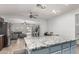 Open concept kitchen with granite island flowing into the living area and access to the backyard pool at 3935 E Graphite Rd, San Tan Valley, AZ 85143