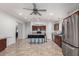 Spacious kitchen with cherry wood cabinets, stainless steel appliances, tile floors, and a blue island with granite countertops at 3935 E Graphite Rd, San Tan Valley, AZ 85143
