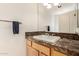 Bathroom featuring vanity with tile backsplash, towel bar, and large mirror at 3935 E Rough Rider Rd # 1183, Phoenix, AZ 85050