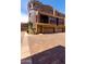 This townhome features a private balcony, desert landscaping, and two-car garage at 3935 E Rough Rider Rd # 1183, Phoenix, AZ 85050