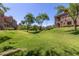 Community green space featuring mature trees and manicured lawn at 3935 E Rough Rider Rd # 1183, Phoenix, AZ 85050