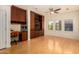 Sunlit home office with built-in desk and cabinetry providing ample storage at 3935 E Rough Rider Rd # 1183, Phoenix, AZ 85050
