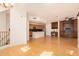 Spacious living room featuring a kitchen, hardwood floors, built-in desk, and stairwell at 3935 E Rough Rider Rd # 1183, Phoenix, AZ 85050