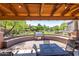 Outdoor kitchen featuring a grill and tables for entertaining in a landscaped community setting at 3935 E Rough Rider Rd # 1183, Phoenix, AZ 85050