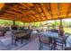 Community outdoor pavilion with comfortable seating, tables, and a fireplace at 3935 E Rough Rider Rd # 1183, Phoenix, AZ 85050