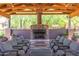 Charming outdoor pavilion featuring a cozy fireplace and comfortable seating at 3935 E Rough Rider Rd # 1183, Phoenix, AZ 85050