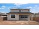 Backyard view of a two-story home with a covered patio and ample space at 4064 E Ghost Flower Ln, San Tan Valley, AZ 85140