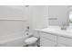 Bathroom featuring a tub, white tile, and a single sink vanity at 4064 E Ghost Flower Ln, San Tan Valley, AZ 85140