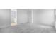 A spacious bedroom with neutral-toned walls and plush gray carpeting at 4064 E Ghost Flower Ln, San Tan Valley, AZ 85140