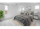 Bedroom is furnished with a queen-sized bed, side tables, and decorative lamps at 4064 E Ghost Flower Ln, San Tan Valley, AZ 85140