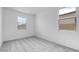 Bright bedroom with two windows and neutral-toned walls and plush gray carpeting at 4064 E Ghost Flower Ln, San Tan Valley, AZ 85140