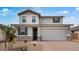 Charming two-story home featuring a neutral color palette, stone accents, and an attached two-car garage at 4064 E Ghost Flower Ln, San Tan Valley, AZ 85140