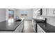 Modern kitchen featuring a large island with a sink, stainless steel appliances, and tiled backsplash at 4064 E Ghost Flower Ln, San Tan Valley, AZ 85140