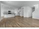 Bright open-plan living and kitchen area with modern appliances and staircase at 4064 E Ghost Flower Ln, San Tan Valley, AZ 85140