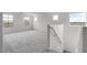 Spacious loft area with multiple windows and plush carpeting at 4064 E Ghost Flower Ln, San Tan Valley, AZ 85140