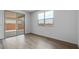 Room with wood-look tile floors, backyard access, and bright natural light at 4064 E Ghost Flower Ln, San Tan Valley, AZ 85140