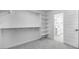 Walk-in closet with built-in shelving and hanging rods, leading into bathroom at 4064 E Ghost Flower Ln, San Tan Valley, AZ 85140